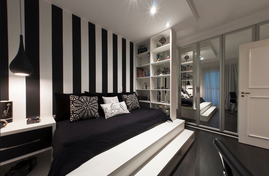 Black and white striped bedroom with storage